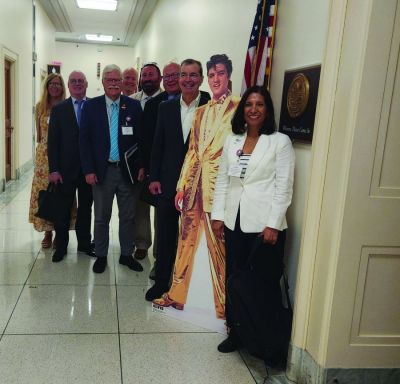 While in Washington, D.C., the NNA public policy team took a photo opp with a pop-up of Elvis Presley.  Left to right: NNA Executive Director Lynne Lance; Public Policy Committee Chair Brett Wesner, publisher, Wesner Publications, Cordell, Oklahoma; NNA Postal Chair Matt Paxton, publisher, The News-Gazette, Lexington, Virginia; Brad Hill, CEO, Interlink of Berrien Springs, Michigan; John Denny Montgomery, publisher, Purcell (Oklahoma) Register; NNA Past President John Galer, publisher, The Journal-News, Hillsboro, Illinois; Brad Thompson, president, Detroit Legal News Publishing LLC; and NNA Chair Martha Diaz Aszkenazy, publisher, The San Fernando Valley (California) Sun/El Sol Newspapers. 
(Lisa McGraw, Pub Aux)