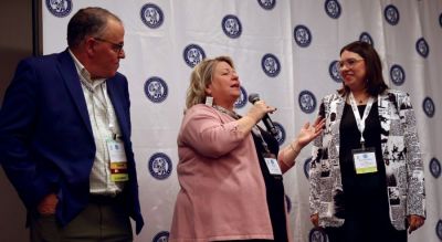 Peggy Scott, (center) assistant publisher, and Katelyn Mary Skaggs, (right) digital marketing manager, Leader Publications, Festus Missouri, discuss working with Steve Rosenfeld of Bluefin Technology Partners to create a self-service system for their advertisers. During Solutions Start Here, convention exhibitors present solutions in use at community newspapers.