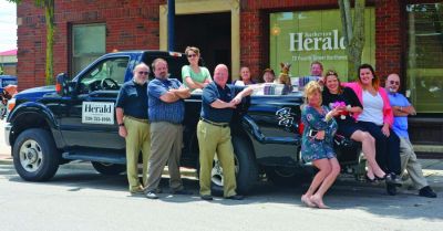 Staff of The Barberton (Ohio) Herald is pictured outside the office building in 2016.